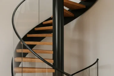 10 Modern Staircase Designs with Glass & Wood